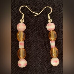 Vintage beads handcrafted into lovely earrings. Amber glass and creamy vintage .